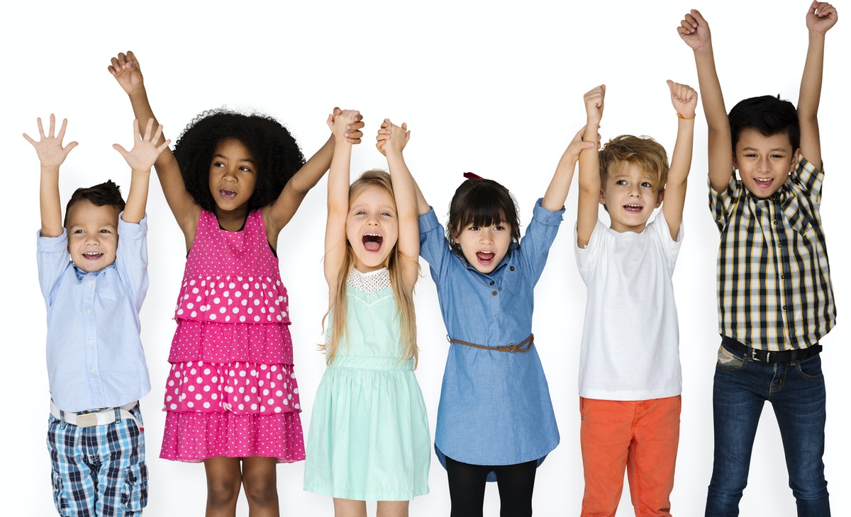 image: happy kids with their hands in the air